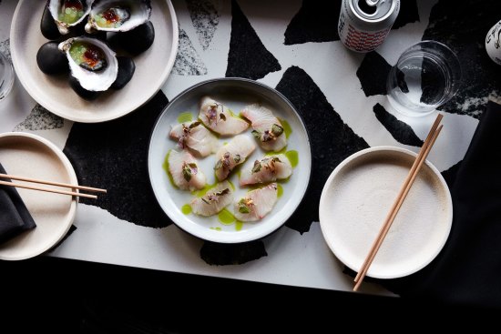 Kingfish with ginger and yuzu vinaigrette, shiso and kombu oil.