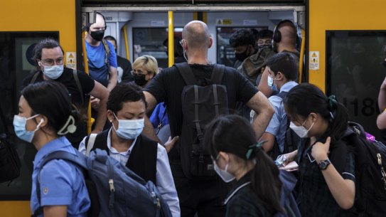 Early morning commuters at Central Station. Metro trains are back running at reduced capacity today, with services on most lines departing every 30 minutes. 22 February, 2022. Photo: Brook Mitchell