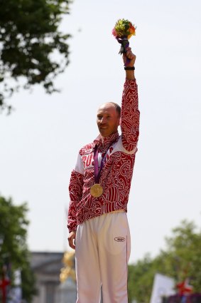 Ban: Sergey Kirdyapkin celebrates victory in London.