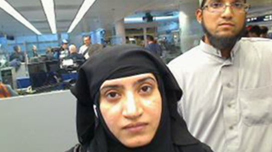 San Bernardino shooters Tashfeen Malik, left, and Syed Farook pictured passing through O'Hare Airport in Chicago in July 2014.