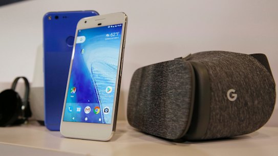 The new Google Pixel phone is displayed next to a Daydream View virtual-reality headset.