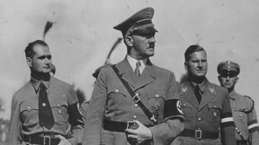 Adolf Hitler with some of his deputies. Rudolf Hess, left, and Baldur V. Schirach, right, in 1936.
