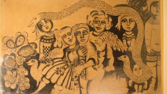 The little boy in the bottom right corner of the mural was uncovered first.