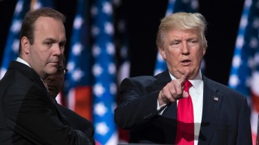 Rick Gates, Manafort's former business associate, stands beside Trump as he prepares for a speech back in July, 2016. 