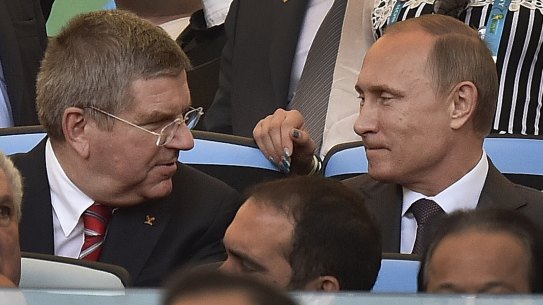 At odds: IOC President Thomas Bach with Russian President Vladimir Putin before the World Cup final in Rio in July.