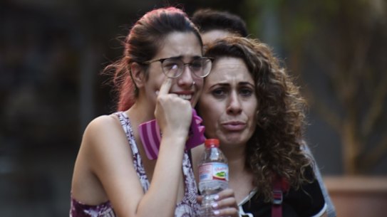 People flee from the scene after the van attack in the historic Las Ramblas district of Barcelona, Spain.