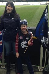 Shocked and disappointed: Carlton supporter Rebecca Hanley and daughter Isabelle, 8.