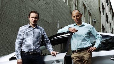 David Rohrsheim, CEO Uber Australia, and SocietyOne CEO Matt Symons outside Uber's offices in Sydney. 