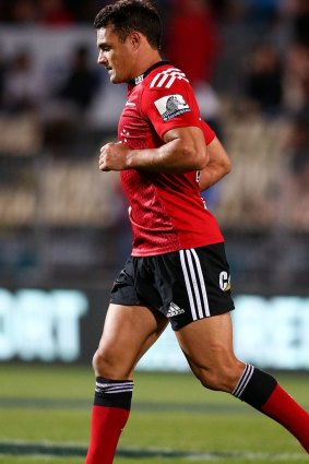 Hobbling off: Dan Carter leaves the field against the Rebels.