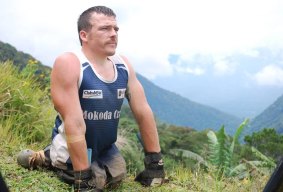 Paralympian Kurt Fearnley on the Kokoda Trail in 2009. He crawled the epic journey in memory of his cousin, Peter Smith, who died by suicide in 2009. Now Kurt is coming to Canberra to again honour the memory of Peter by attending a fundraising dinner for the 6NIL anti-suicide campaign and for Liifeline.