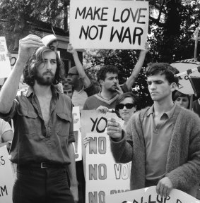 Vietnam war protesters burning their national service registration cards at an anti-conscription rally.