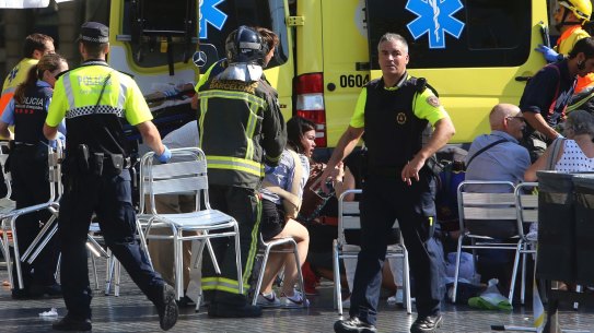 Injured people are treated in Barcelona, Spain, after the vehicle attack.
