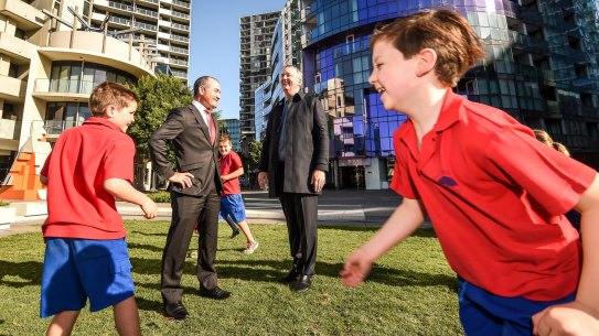 Education Minister James Merlino and Housing Minister and Albert Park MP Martin Foley with students from Port Melbourne Primary School.