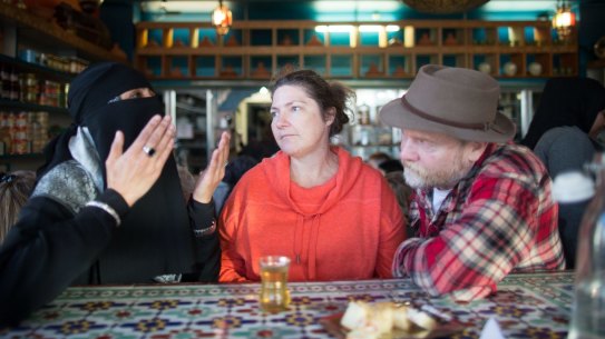 A woman in niqab speaks with non-Muslims at a "speed-dating" event in Brunswick. 