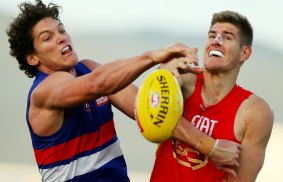 Prospect: Gold Coast Suns ruckman Zac Smith (right) is in the sights of the Bombers.