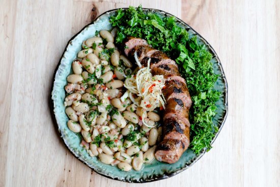 Spiced pork sausage, kale, cannellini beans, daikon, criolls. 