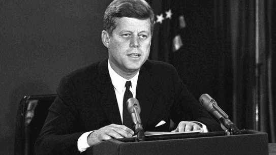 President John F. Kennedy announces a naval blockade of Cuba until Soviet missiles are removed. 