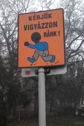A sign asking drivers to look out for children on the grounds of Count Istvan Karolyi's estate home to an orphanage caring for migrants, outside Budapest.