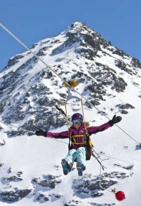 Cool experience: A teen rides the world's highest zip-line at Val Thorens, France.