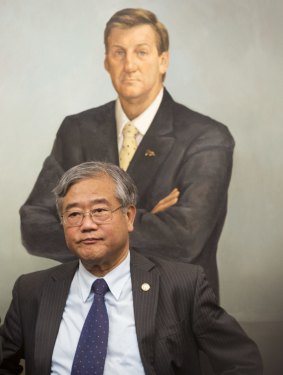Clarinda MP Hong Lim at the Victorian Parliament, in front of a portrait of former premier Jeff Kennett.