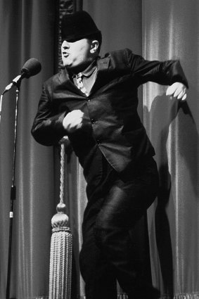Alexei Sayle as the ''Cockney mod poet'' during a benefit concert at London's Palladium in the early 1980s.
