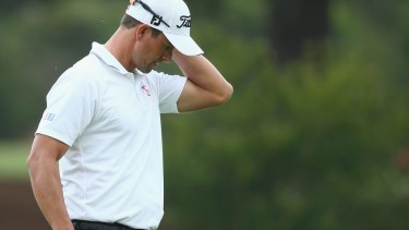Frustrating morning: Adam Scott reacts after a missed putt on the 10th hole.