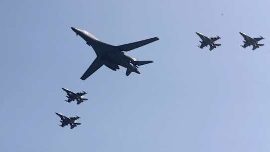 A US B-1 bomber flanked by fighter jets during a show of force over the Korean Peninsula in September 2016.