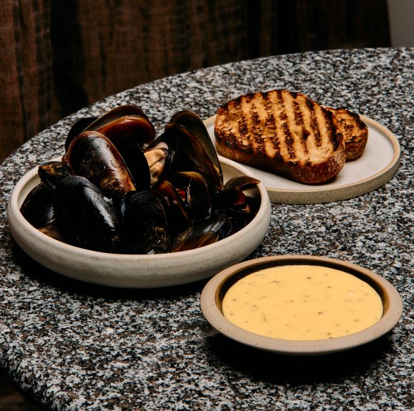 Port Phillip mussels cooked in white wine and served with native thyme bearnaise and toast, one of Ben Shewry's dishes served at the Atrium.