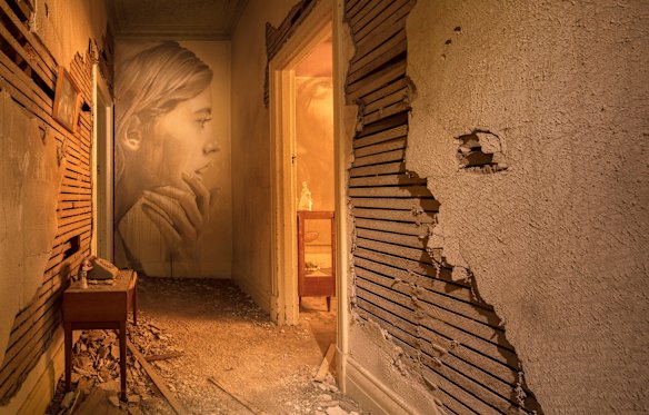 The hallway shows the state of disrepair in the house once owned by a plasterer.