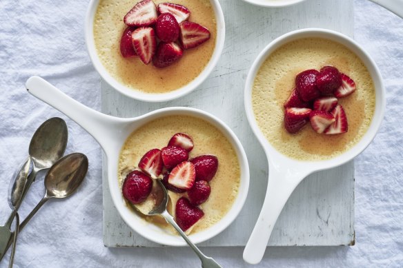 Vanilla pots de creme with macerated strawberries.