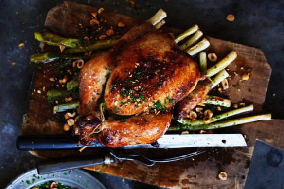 Neil Perry's roast chicken with apple cider leeks and hazelnuts.