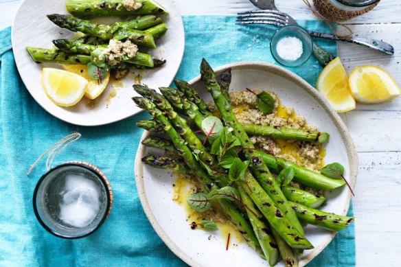 Barbecued asparagus with nutty tarator.