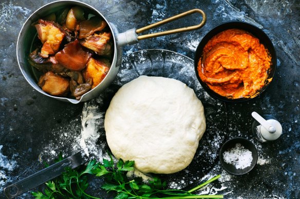 Char-grilled calzone, stuffed with avjar and slow-cooked pork.