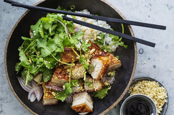 Crispy pork belly with coriander, peanuts and red onion salad.
