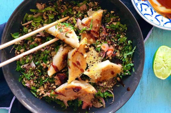 Lacy potsticker dumplings on a bed of roasted cauliflower, herb and pickled ginger salad.