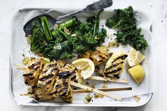 Turmeric fish skewers and garlic greens.