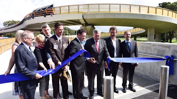 Roads Minister Duncan Gay cuts the ribbon at the bridge's opening.