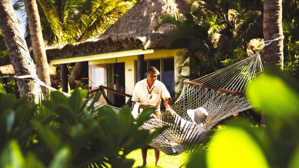 Relaxing outside a bure (private cabin) at Outrigger Fiji Beach Resort.