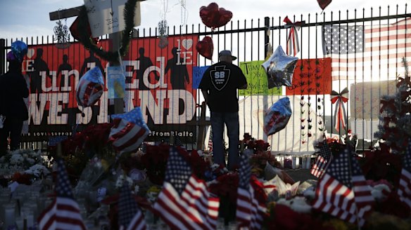 David Santos pays his respects at the memorial site.