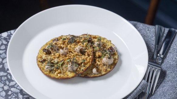 Socca (chickpea pancakes) topped with fermented walnuts.