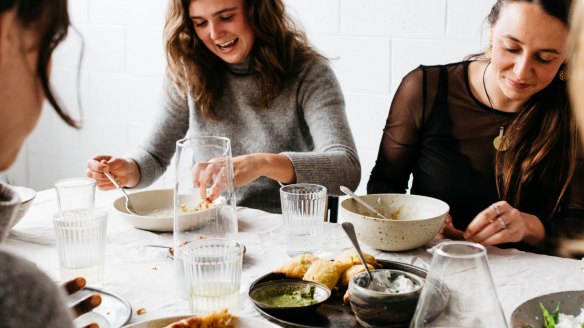 Guests sharing a meal at Free to Feed, a Melbourne social enterprise connecting people through food. 