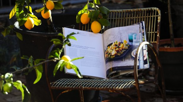Tracey Ryan's lemon and lime trees and Matt Moran's kitchen garden book at her Ainslie home.