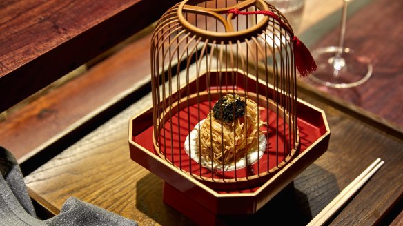 "Sea treasure" ball presented in a wooden birdcage.