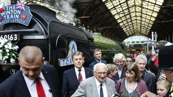 Nicholas Winton, centre, who organised the Winton Train rescue of Jewish children from Czechoslovakia prior to WWII, visits Liverpool Street Station in London in 2004.