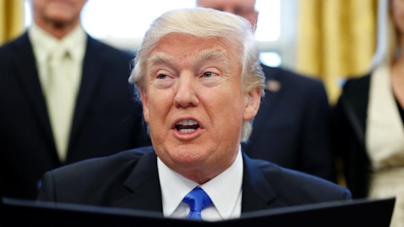 Donald Trump speaks before signing the executive action in the Oval Office.