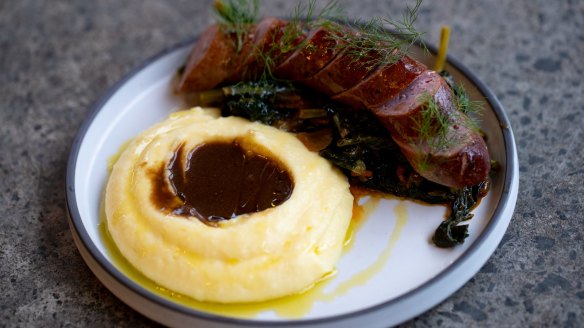 House-made pork and fennel sausage with collard greens, mash and gravy.