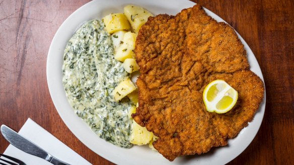 The infamous wiener schnitzel served with potatoes and creamed spinach.