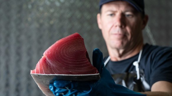 Walker Seafood production manager Daniel Jones with a fresh yellowfin tuna fillet.