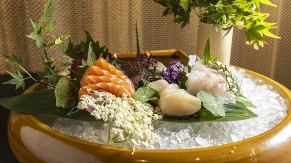 A sashimi platter is prettily arranged.