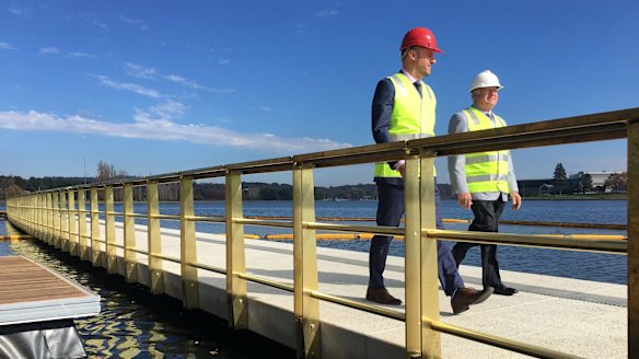 Andrew Barr and Mick Gentleman check out the first part of the West Basin boardwalk on Tuesday.